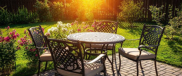 Table and chairs in garden of country house Selective focus garden furniture